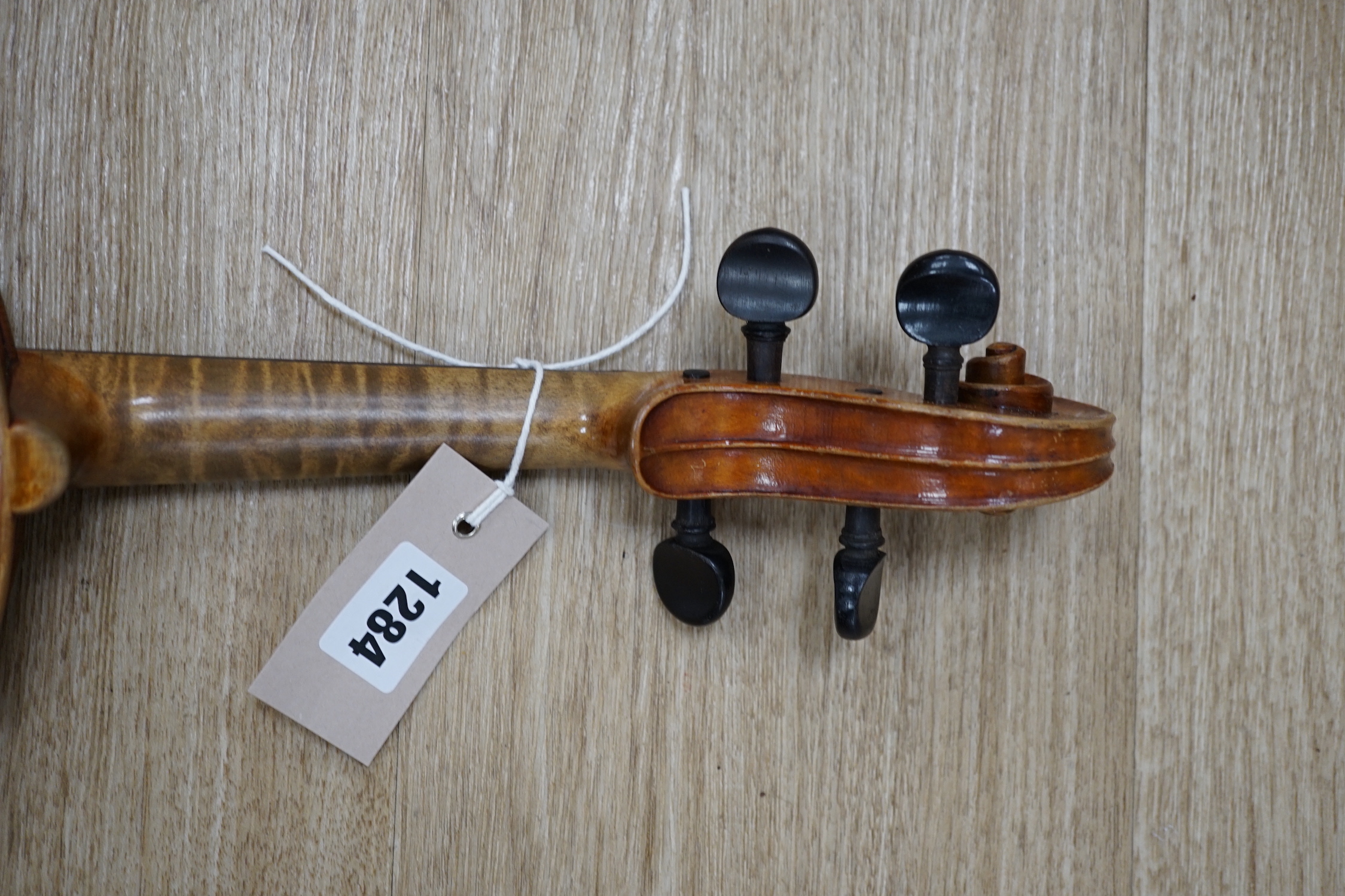 An uncased early 20th century violin, length of body 35.5cm